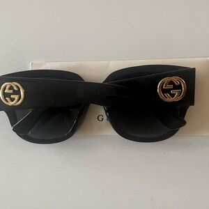 Woman’s Gucci butterfly sunglasses with GG logo on temples